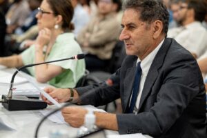 One delegate at the 11th ETC MInisterial at COP30, with others in the background